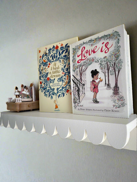 scalloped shelf with books and music box